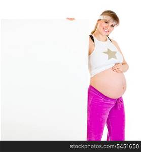 Smiling beautiful pregnant female holding blank billboard isolated on white&#xA;