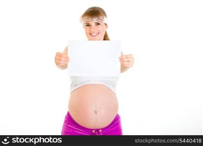 Smiling beautiful pregnant woman holding empty white paper isolated on white&#xA;