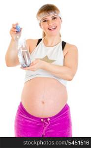 Smiling beautiful pregnant woman in sportswear holding bottle of water&#xA;