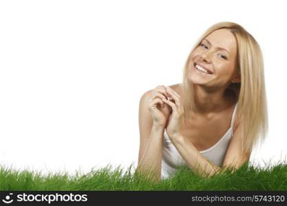Smiling beautiful woman on grass isolated on white background