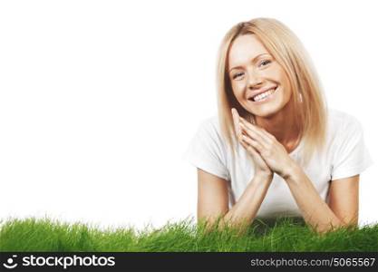 Smiling beautiful woman on grass isolated on white background. Smiling woman on grass