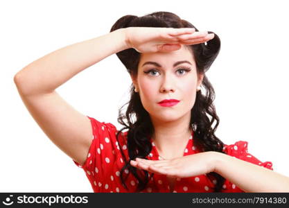 Smiling beautiful young woman isolated on white in old fashion clothes making a frame with hands pinup and retro style