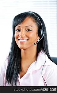 Smiling black customer service and support woman wearing headset