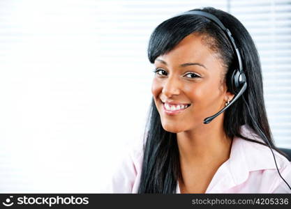 Smiling black customer service and support woman wearing headset