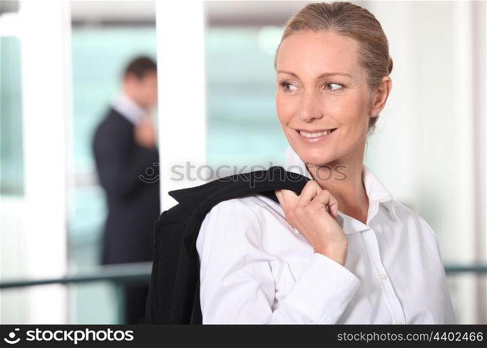 Smiling blond woman looking away