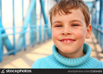 Smiling boy on bridge