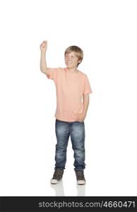 Smiling boy raising his arm holding something isolated on white background