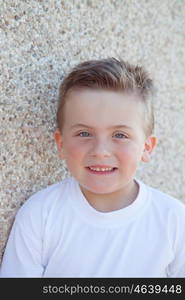 Smiling boy with blue eyes about 5 years looking at camera