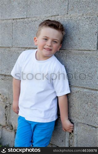 Smiling boy with blue eyes about 5 years looking at camera