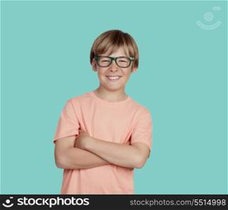 Smiling boy with glasses on a green background