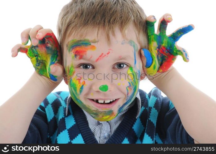 smiling boy with the palms painted by a paint. Isolated on white background