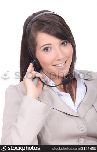 Smiling brunette wearing a headset
