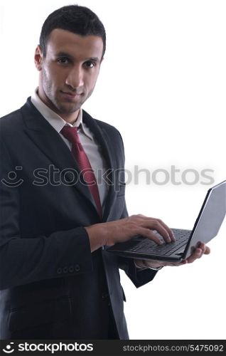Smiling business man hold and work on mini laptop comuter Isolated on white background in studio