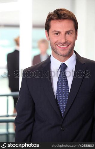 Smiling business man standing