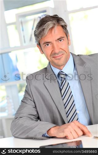 Smiling business manager in office