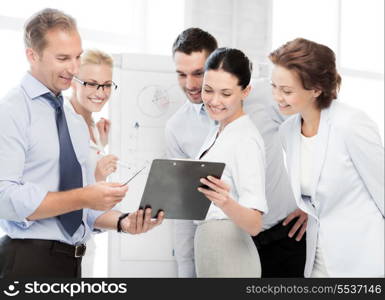 smiling business team discussing something in office