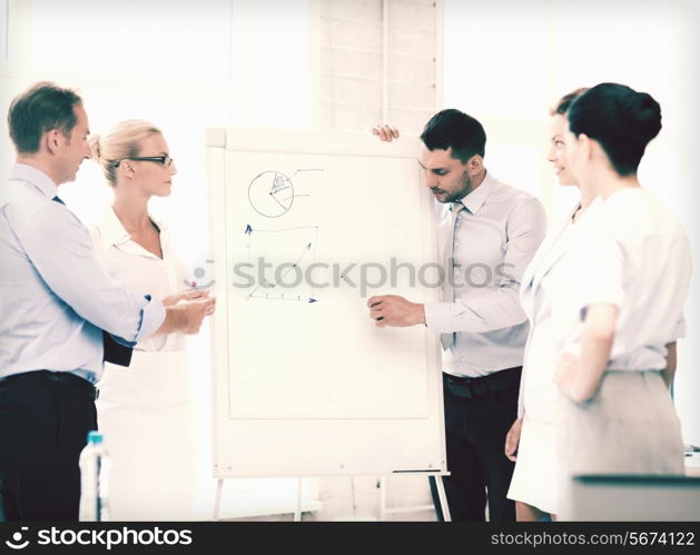 smiling business team discussing something in office