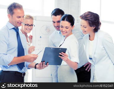 smiling business team discussing something in office. business team discussing something in office