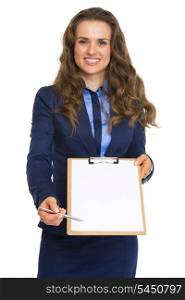 Smiling business woman giving clipboard for sign