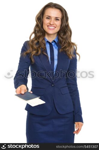 Smiling business woman giving passport with air tickets