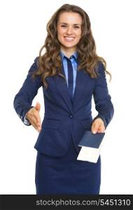 Smiling business woman giving passport with air tickets and stretching hand for handshake