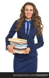Smiling business woman holding stack of books