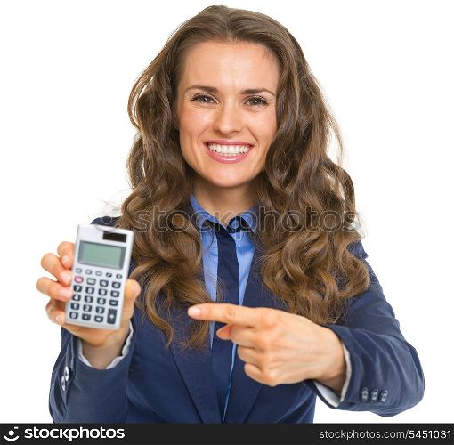 Smiling business woman pointing on calculator
