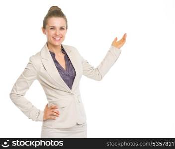 Smiling business woman pointing on copy space