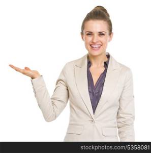 Smiling business woman presenting something on empty palm