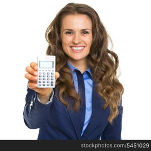 Smiling business woman showing calculator