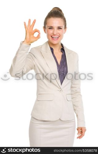 Smiling business woman showing ok gesture