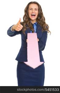 Smiling business woman showing thumbs up and pointing with arrow in camera
