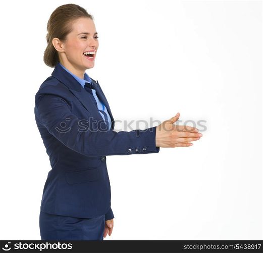 Smiling business woman stretching hand for handshake