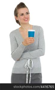 Smiling business woman with cup of coffee looking on copy space
