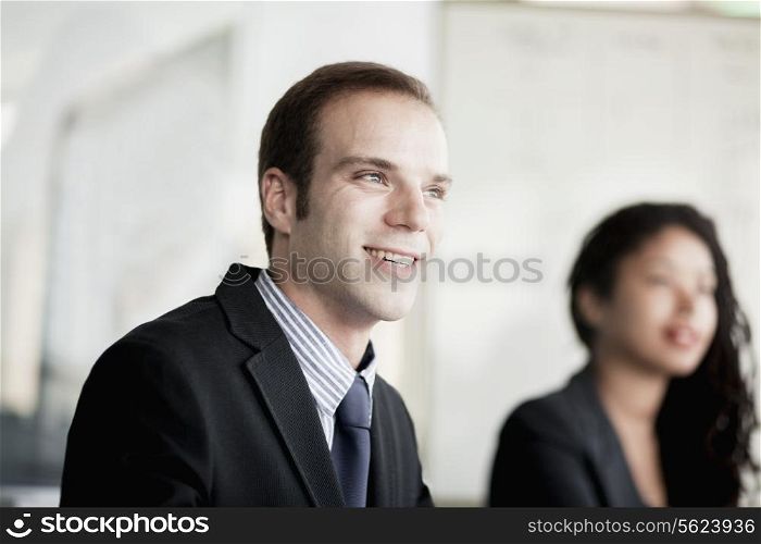 Smiling businessman at a business meeting