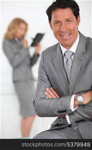 smiling businessman in foreground
