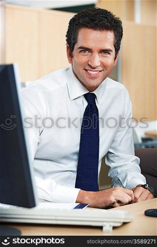 Smiling businessman in office portrait