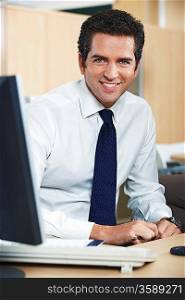 Smiling businessman in office portrait