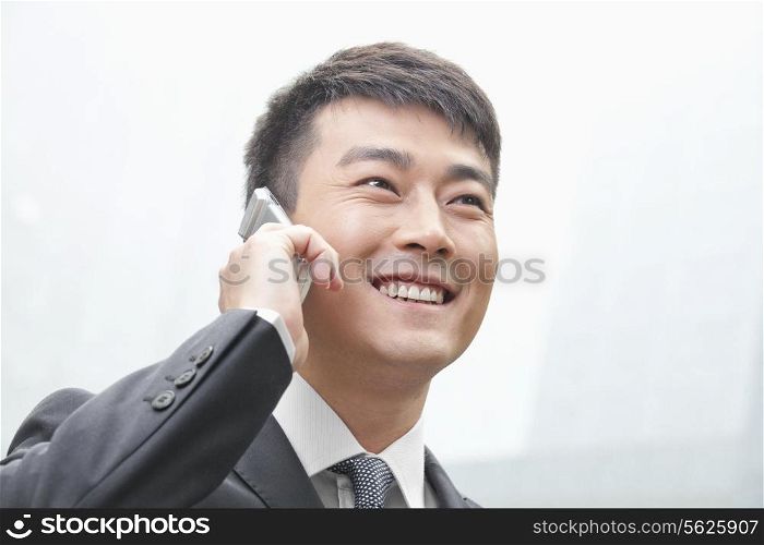 Smiling Businessman on the Phone in Beijing