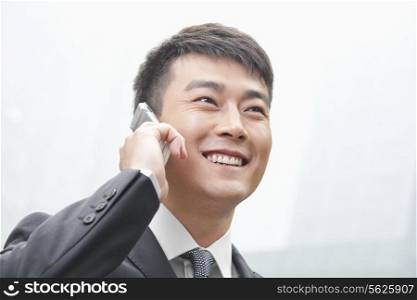 Smiling Businessman on the Phone in Beijing