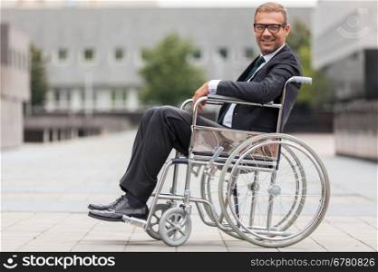 Smiling businessman on wheelchair