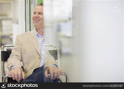 Smiling businessman sitting in office