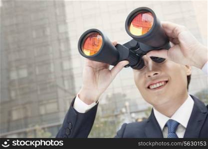 Smiling Businessman Using Binoculars, Reflection