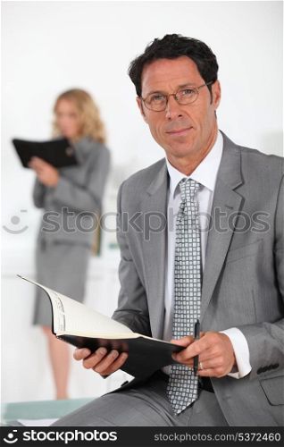 smiling businessman with book