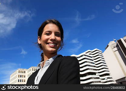 Smiling businesswoman in the city