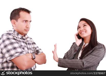 smiling businesswoman on the phone signaling his couple to hold on