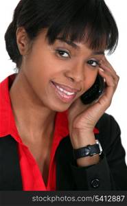 Smiling businesswoman taking a phone call