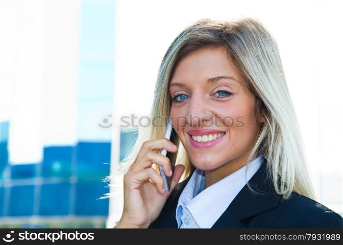 Smiling businesswoman talking on the phone