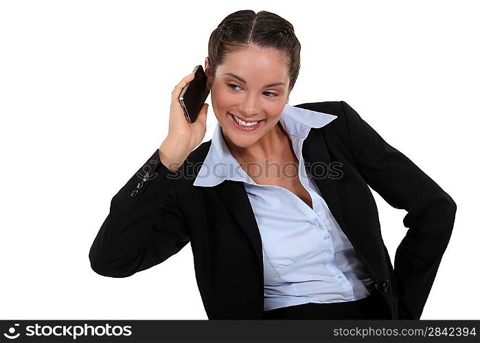 Smiling businesswoman using a cellphone