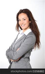 Smiling businesswoman with arms crossed